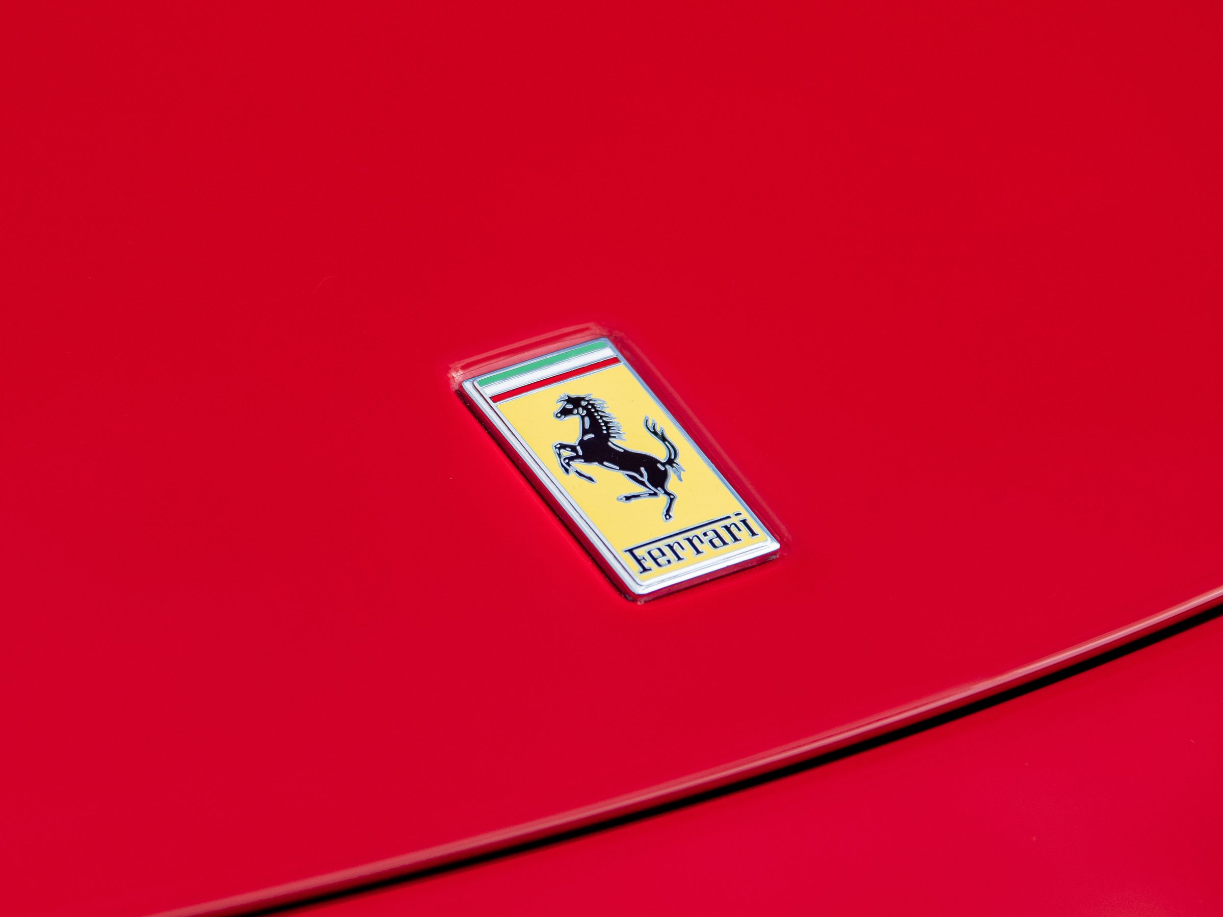 Ferrari shield badge on the Rosso Corsa bonnet of a 2008 F430 F1 Spider